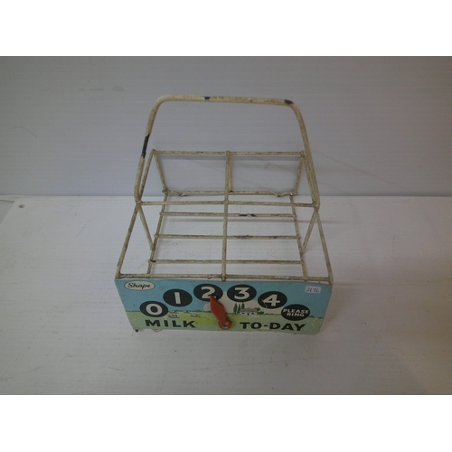262 - A vintage milk bottle holder