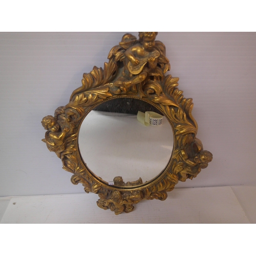 266 - A gilt framed mirror with cherubs - 44cmH x 32cmW