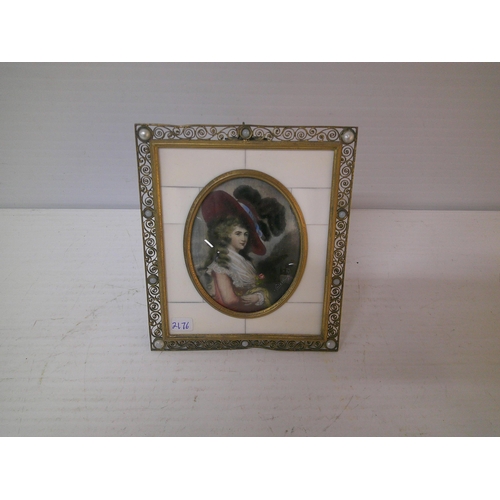 267 - A brass framed miniature of a lady - 13.5cm x 12cm