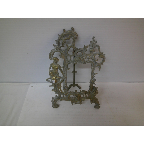 272 - An ornate brass picture frame - 31cmH