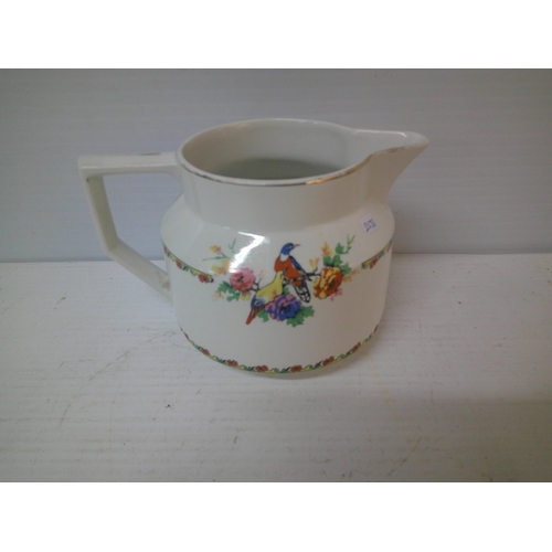 279 - A Nelson Ware coloured pottery jug - 12cmH