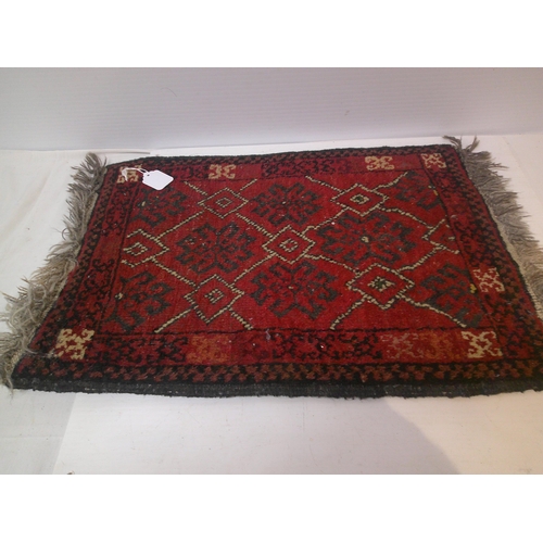 288 - A red hand knotted prayer mat - 62cm x 44cm