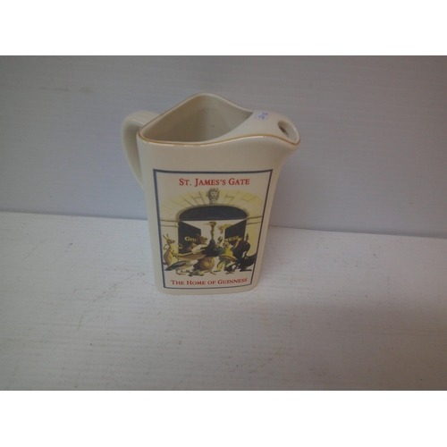 292 - A Guinness pub jug - 18cmH