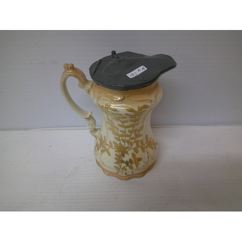 299 - ED, guilded milk jug with pewter lid