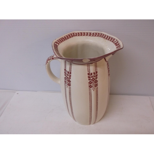 396 - A tall Royal Doulton pottery jug, minor damage 31cmH.