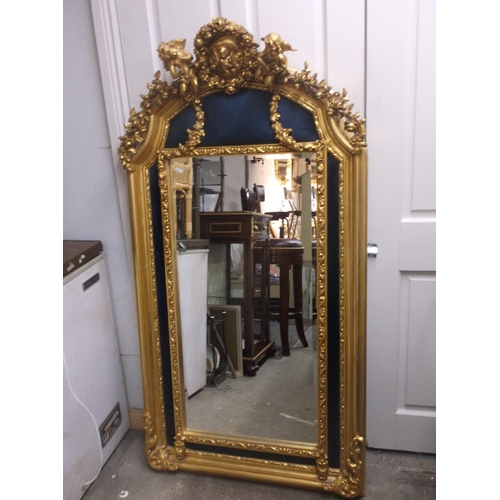 414 - A tall decorative framed mirror with Cherubs 152cmH X 80cmW