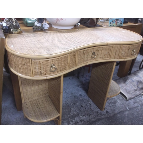 420 - A cane bow front dressing table