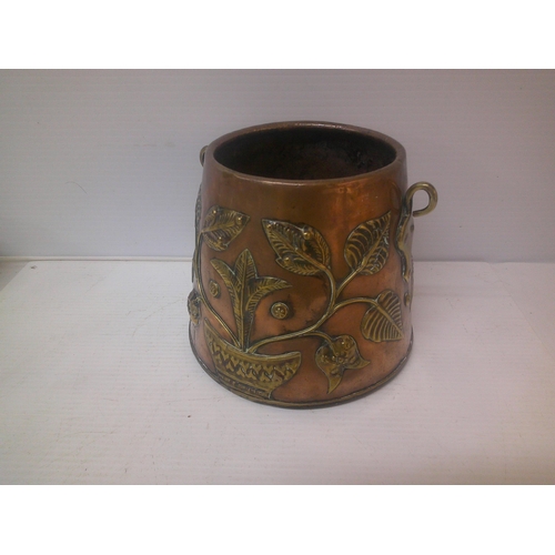 76 - An arts & crafts copper & brass pot 25cmD X 20cmH