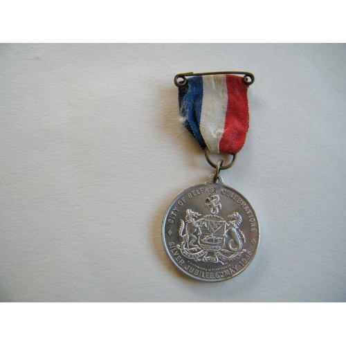 204 - A 1935 City of Belfast celebration medal and ribbon