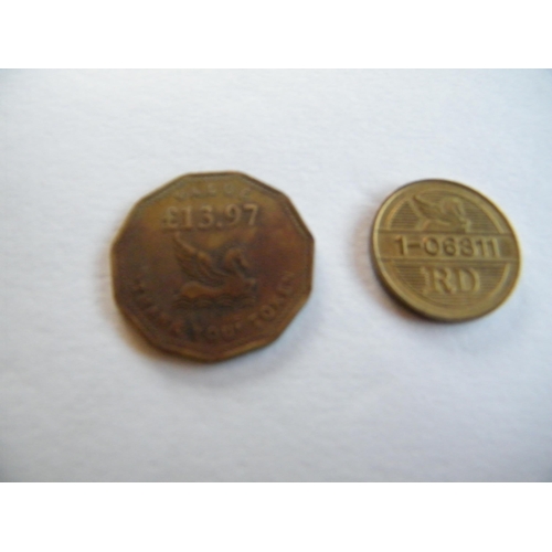 209 - Two Reader’s Digest coins – one valued at £13.97 and the other is a French 1-06311 coin