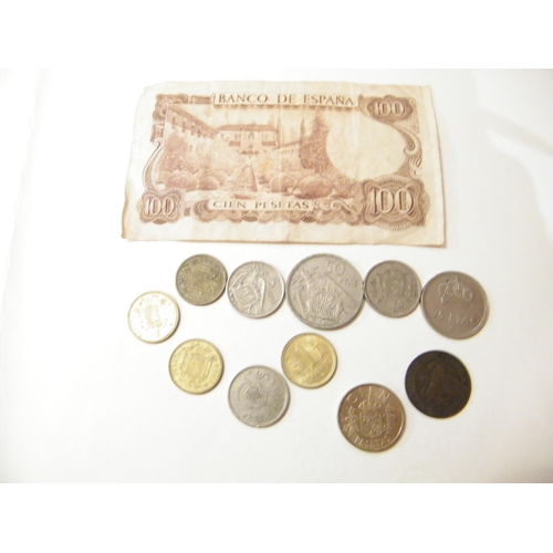 215 - A Spanish 100 peseta note and eleven Spanish coins including 1870 five centimes