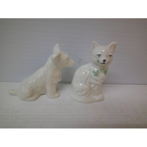 301 - A Belleek dog and cat - 10cmH