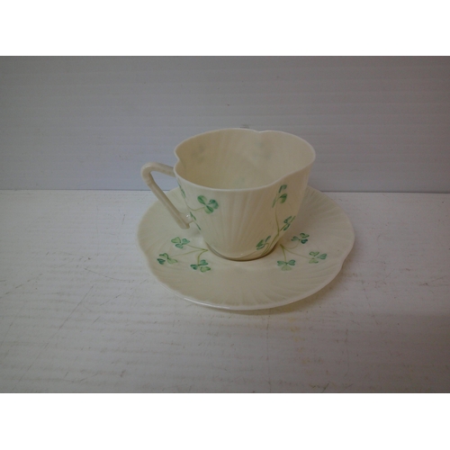 304 - A Belleek 6th period shamrock pattern cup and saucer