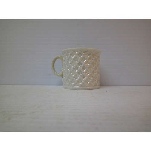 323 - A Belleek 2nd period mug - 6.5cmH