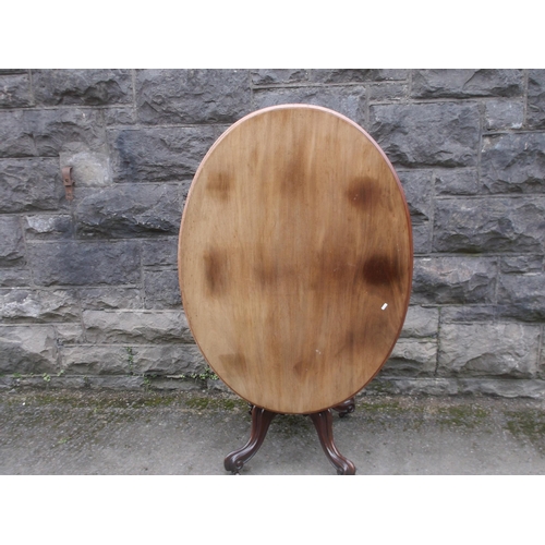 417 - A Victorian tip up oval mahogany breakfast table 122cm