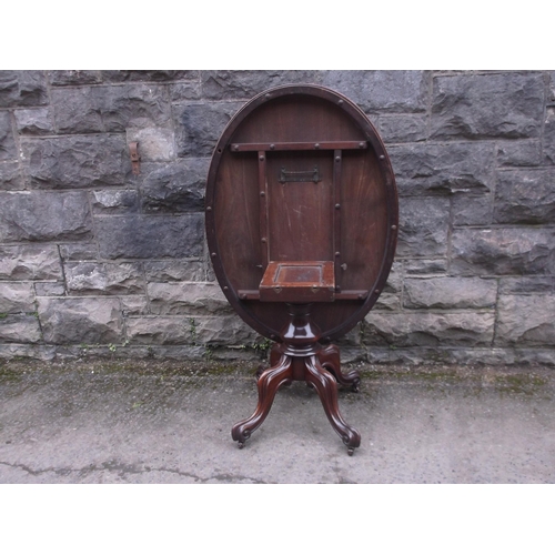 417 - A Victorian tip up oval mahogany breakfast table 122cm