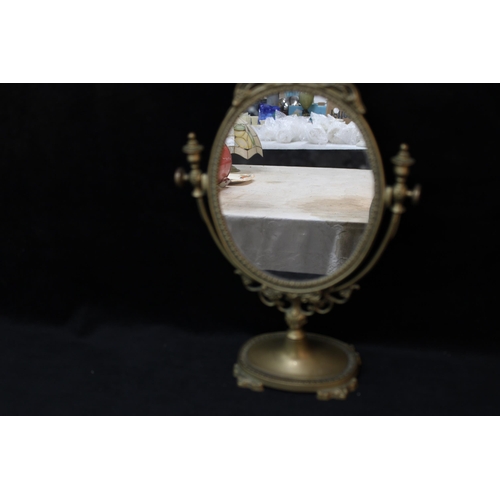 128 - A brass framed table top mirror - 38cmH x 26cmW