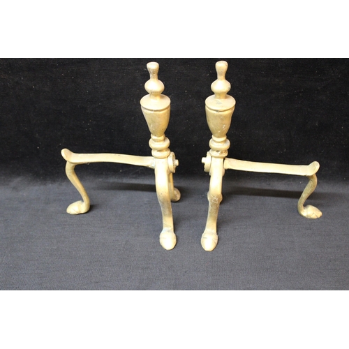 140 - A pair of brass fire dogs - 23cm x 15cm each