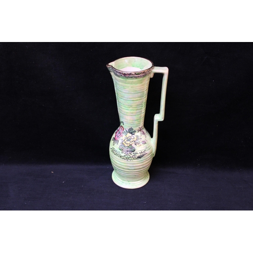 17 - An Arthur Wood green pottery jug 29cmH