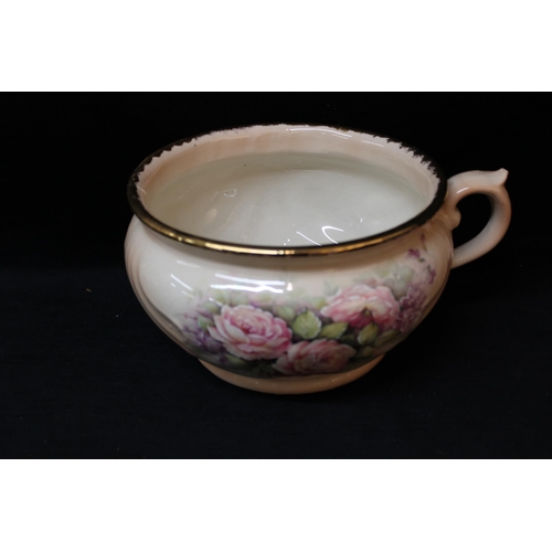 18 - A coloured pottery chamber pot