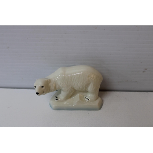 404 - A Belleek polar bear 12cmW X 8cmH blue mark