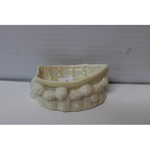 406 - A Belleek boat 11cmW X 4.5cmH