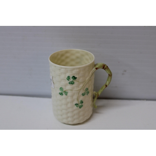 409 - A Belleek shamrock pattern mug 10cmH gold mark