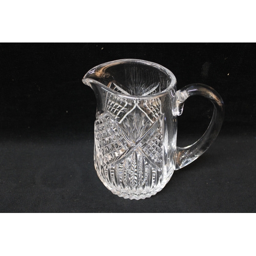 237 - A Tyrone cut crystal glass water jug - 17cmH