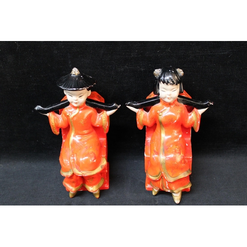 195 - A pair of oriental book ends - 21cmH each