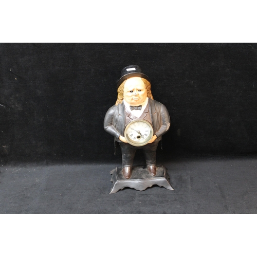 265 - A cast iron John Bull figure & clock - 39cmH