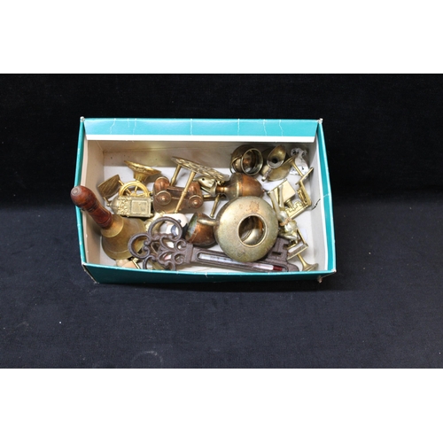79 - A small box of brassware
