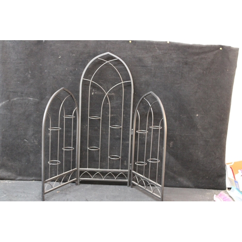 255 - A metal folding candle holder 79cmH X 94cmW