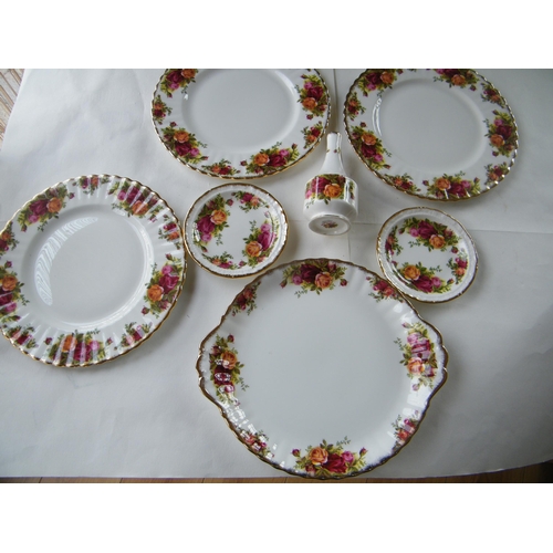 310 - Seven pieces of Royal Albert 'Old Country Roses'