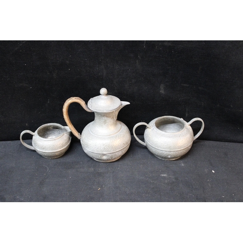 344 - A pewter Art & Crafts set - jug -18cmH