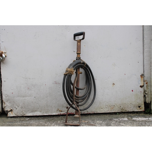 43 - An original stirrup pump complete 71cmH