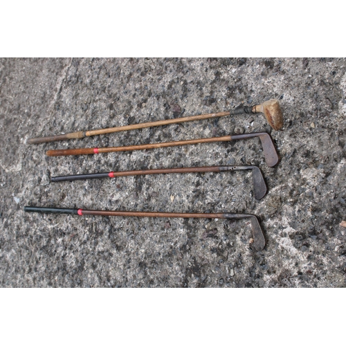 50 - Four vintage hickory shaft golf clubs