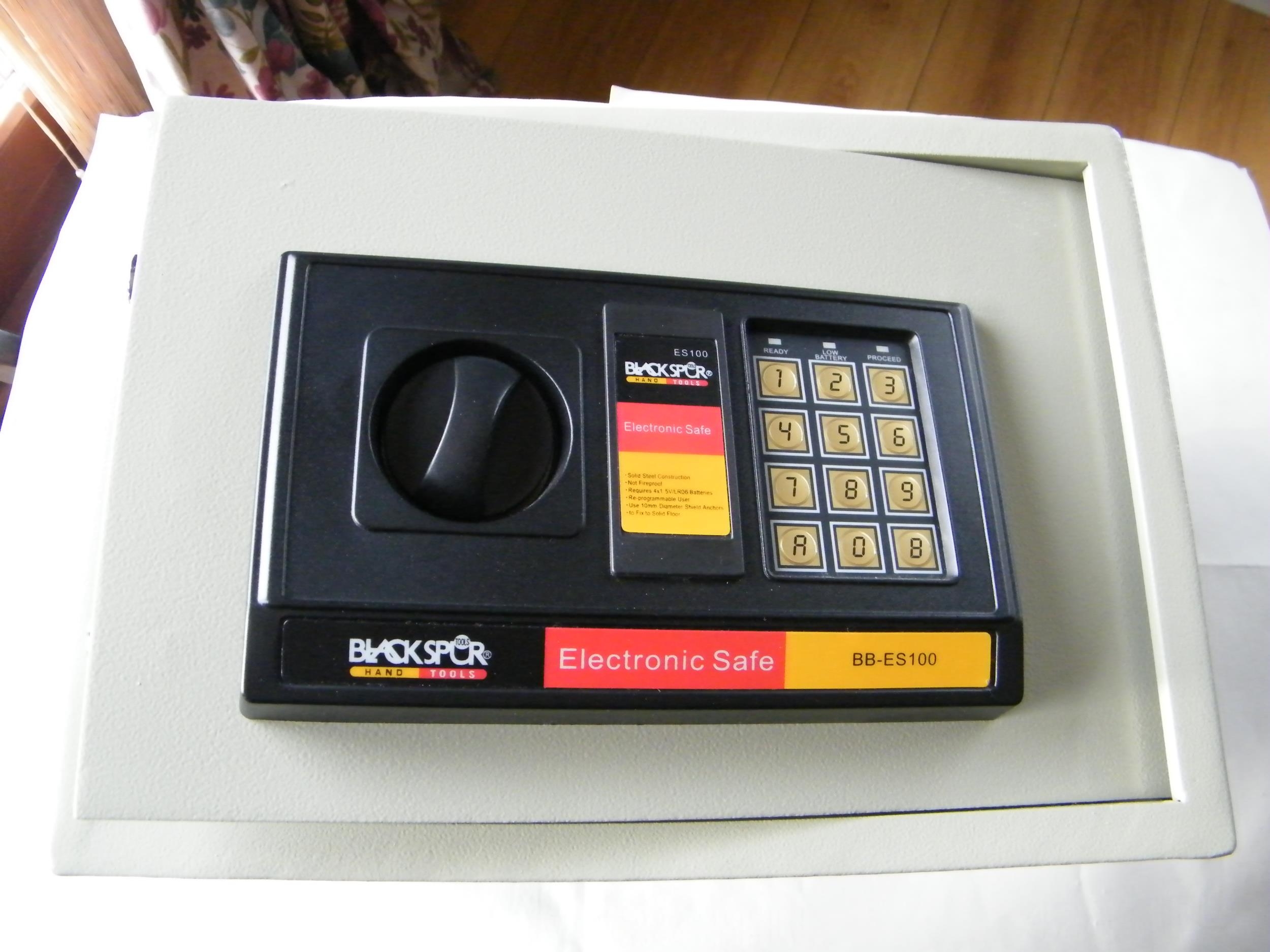 An electronic safe complete with key and fixing bolts - 35cm x 25cm x 25cm