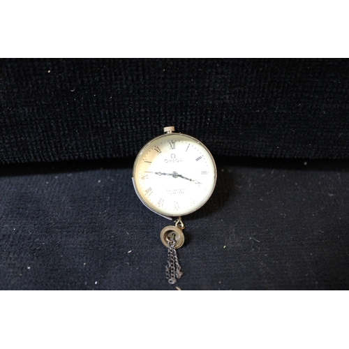An Omega glass ball desk clock - 3.5cmD x 2.5cm