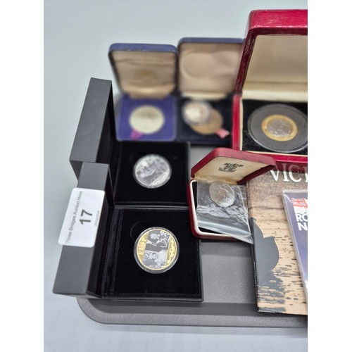 17 - A Collection of boxed mint coins; Royal Naval £5 commemorative coin, The Road to Victory coins and R... 