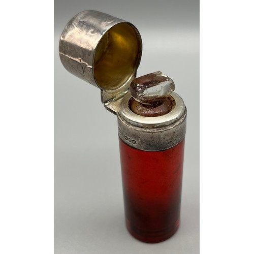 44 - London silver and ruby glass cylinder shaped perfume bottle. Has original stopper present. [8cm high... 