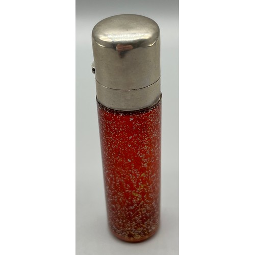 45 - Antique silver and ruby speckled glass, cylinder shaped perfume bottle. Has original stopper present... 