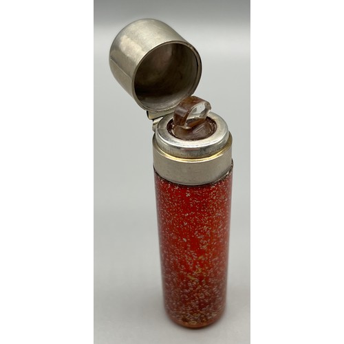 45 - Antique silver and ruby speckled glass, cylinder shaped perfume bottle. Has original stopper present... 