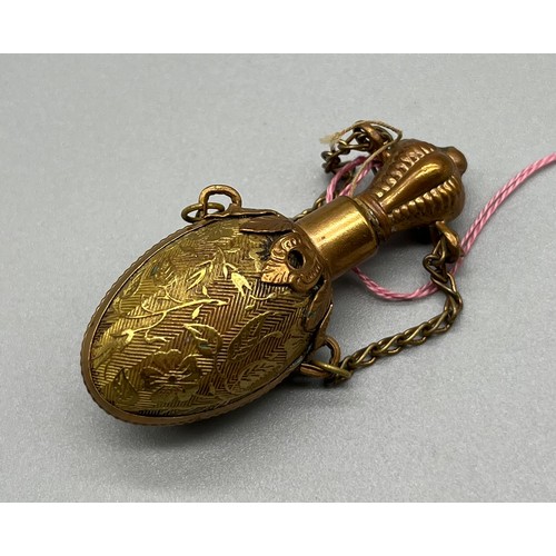 59 - Victorian Brass gilt Chatelaine perfume scent bottle in the form of an egg. [5.5cm high]