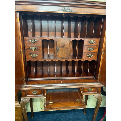 357 - 20th century Yew and walnut cabinet on stand complete with key. Made in two parts. The two cupboard ... 