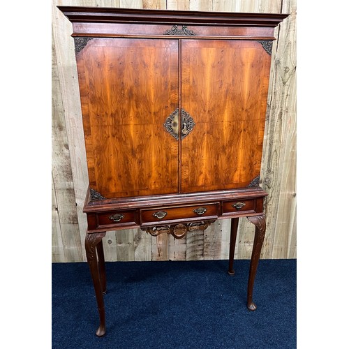357 - 20th century Yew and walnut cabinet on stand complete with key. Made in two parts. The two cupboard ... 