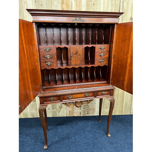357 - 20th century Yew and walnut cabinet on stand complete with key. Made in two parts. The two cupboard ...