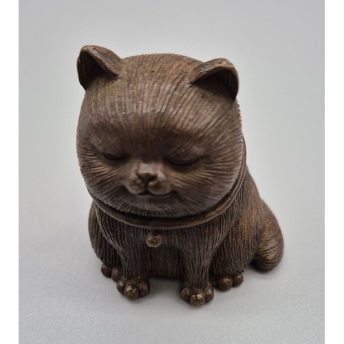 136 - Chinese Bronze Cat sculpture signed to the base. [6cm high]