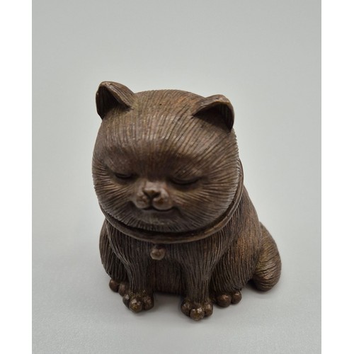 136 - Chinese Bronze Cat sculpture signed to the base. [6cm high]