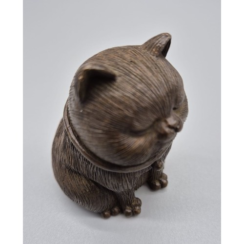 136 - Chinese Bronze Cat sculpture signed to the base. [6cm high]