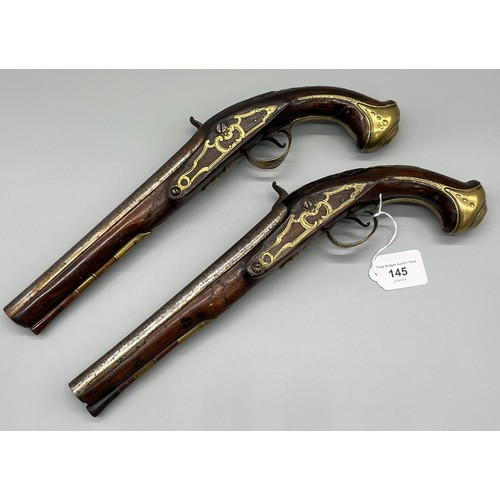 145 - A Pair of 18th/ 19th century Percussion Cap duelling pistols. Marked No.9 to each of the brass carto...